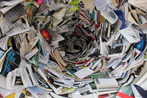 A large pile of documents that require destruction