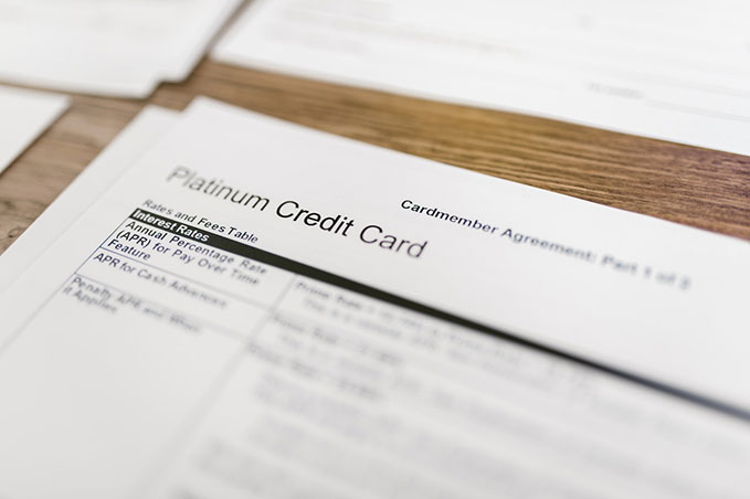 A close-up of a credit card agreement that’s printed on white paper