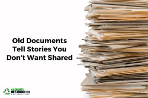 Stack of old documents and folders promoting secure paper shredding and document destruction services by Absolute Destruction & Recycling Corp. in Toronto.